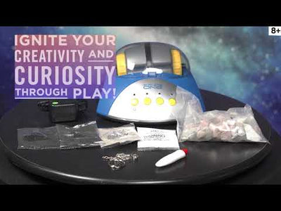 a blue and white device with buttons and a bag of pills