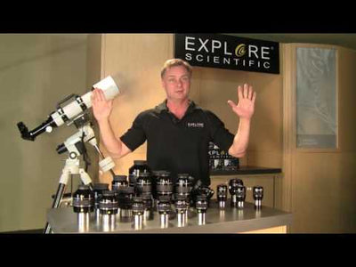 a man standing in front of a telescope